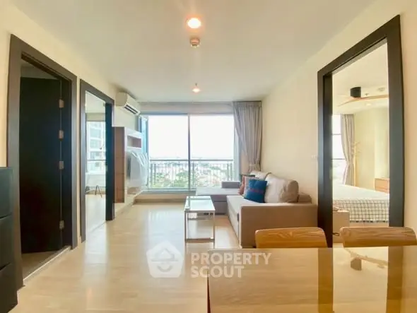 Spacious modern living room with large windows and stylish decor