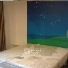 Cozy bedroom with unique starry night wall art and comfortable bed.