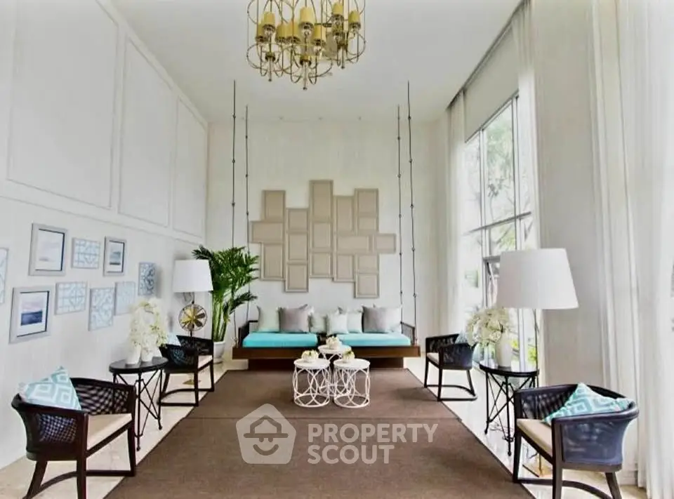 Luxurious living room with elegant decor, high ceilings, and large windows for natural light.