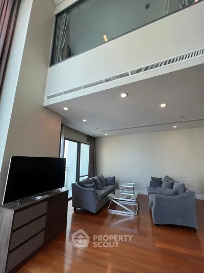 Spacious modern living room with high ceiling and stylish furniture