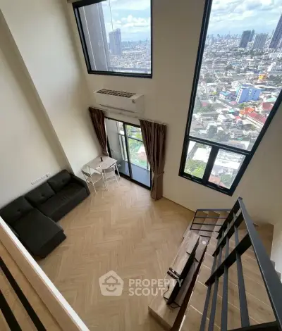 Stunning loft apartment with floor-to-ceiling windows and breathtaking city views.