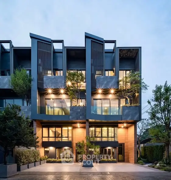Modern architectural building with unique facade and lush greenery