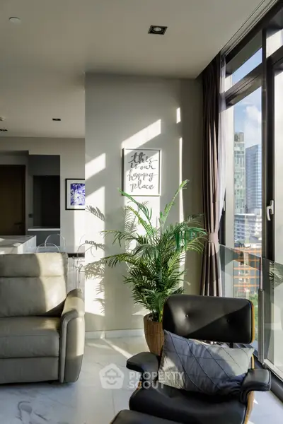 Luxurious living room with modern furniture and city view, perfect for urban living.