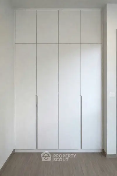 Modern built-in wardrobe with sleek design and ample storage space