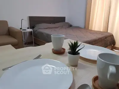 Cozy studio apartment with modern decor and inviting ambiance