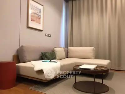 Modern living room with cozy beige sofa and stylish coffee table, perfect for relaxation.