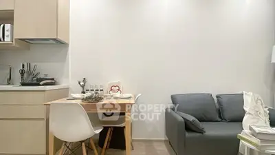 Modern apartment interior with cozy living area and compact kitchen
