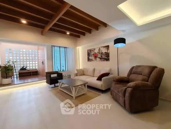 Spacious living room with modern decor and cozy seating area