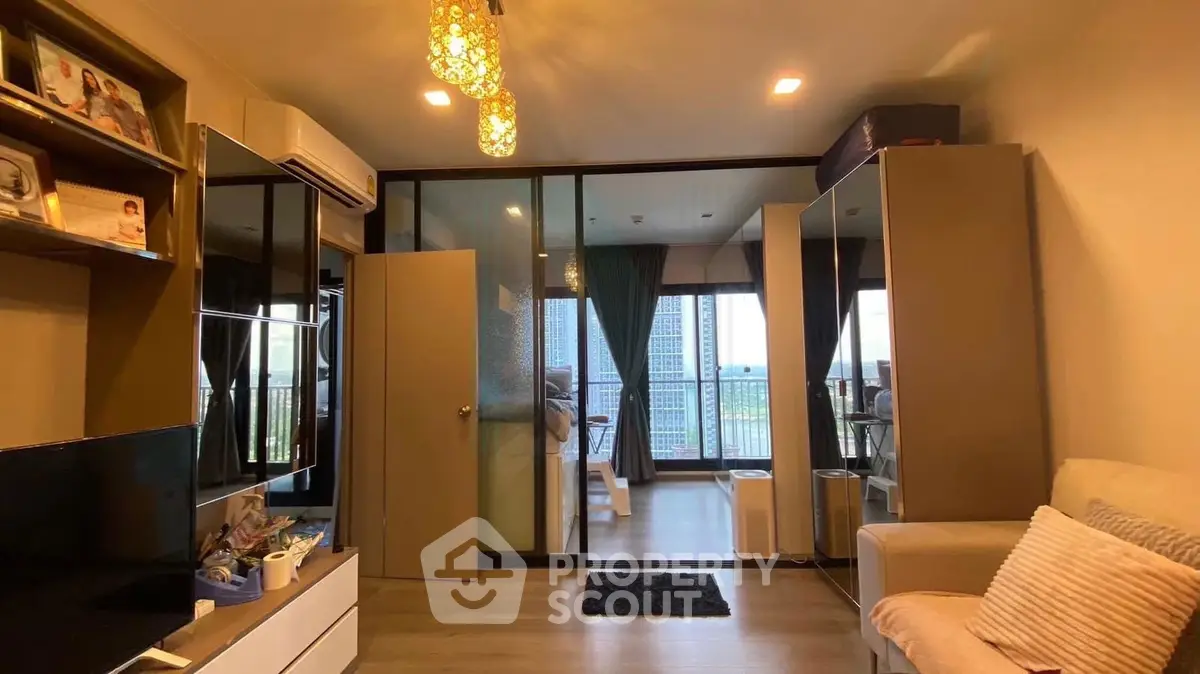 Modern living room with glass partition and city view balcony