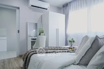 Modern bedroom with cozy decor and natural light