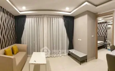 Modern living room with stylish decor and cozy seating in a contemporary apartment.