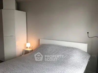 Cozy bedroom with minimalist decor and soft lighting