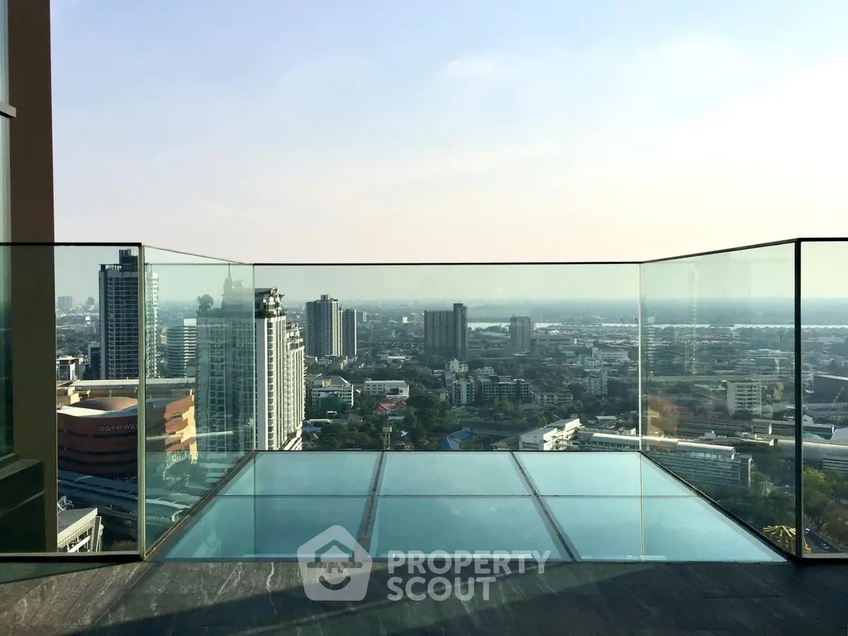 Stunning cityscape view from a modern glass balcony, perfect for urban living.