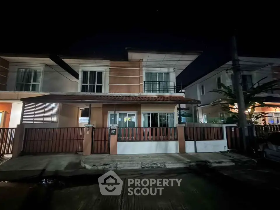 Charming two-story house with modern design and spacious front yard, perfect for family living.