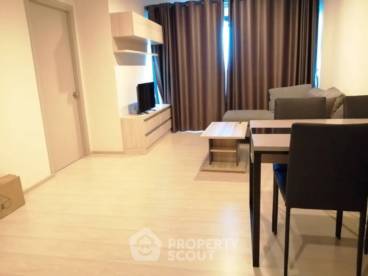 Modern living room with sleek furniture and natural light, perfect for cozy gatherings.