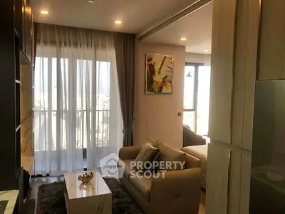 Modern living room with cozy sofa and large window view