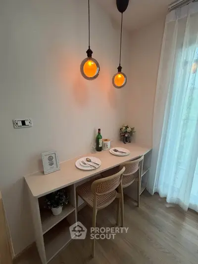 Cozy dining nook with modern pendant lights and elegant table setting