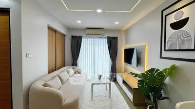 Modern living room with sleek design, cozy sofa, and stylish decor in a contemporary apartment.