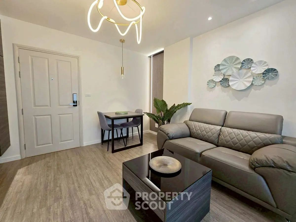 Modern living room with stylish decor and cozy seating area, perfect for relaxation and entertaining.