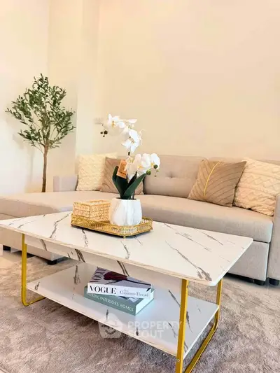 Elegant living room with modern sofa and marble coffee table, perfect for stylish urban living.