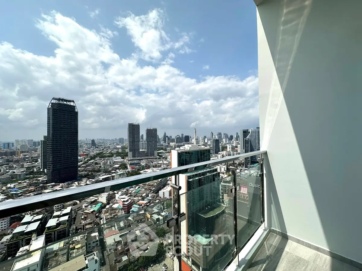 Stunning cityscape view from a modern high-rise balcony, perfect for urban living enthusiasts.