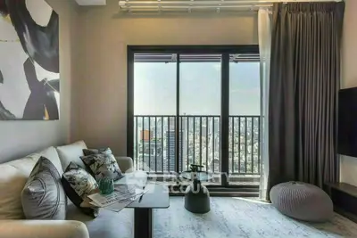 Stylish living room with city view, modern decor, and cozy seating area.