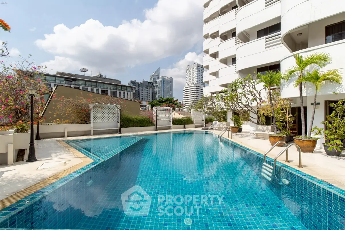 Luxurious urban apartment with stunning pool and city views, perfect for modern living.