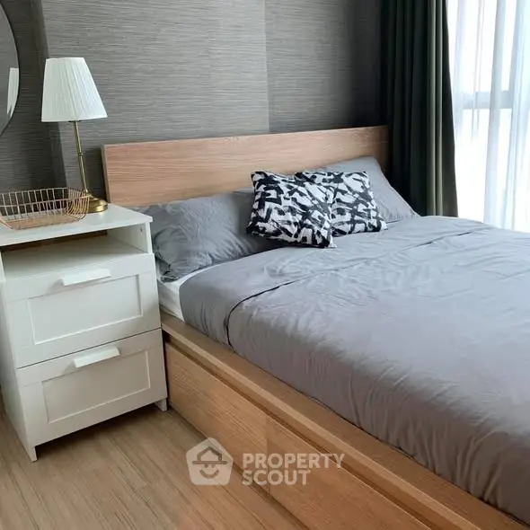 Modern bedroom with stylish decor and natural light