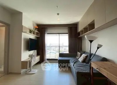 Spacious living room with modern decor and large window offering stunning city views.