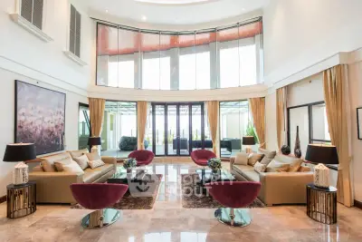 Luxurious spacious living room with high ceilings and elegant decor