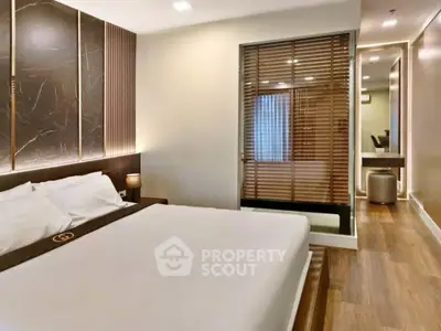 Luxurious modern bedroom with elegant decor and ambient lighting