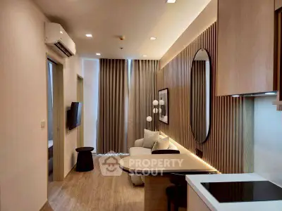 Modern living room with stylish decor and open kitchen layout