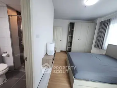 Modern bedroom with ensuite bathroom and ample storage space