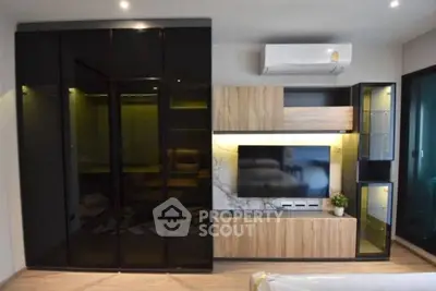 Modern living room with sleek black cabinets and stylish wooden TV unit