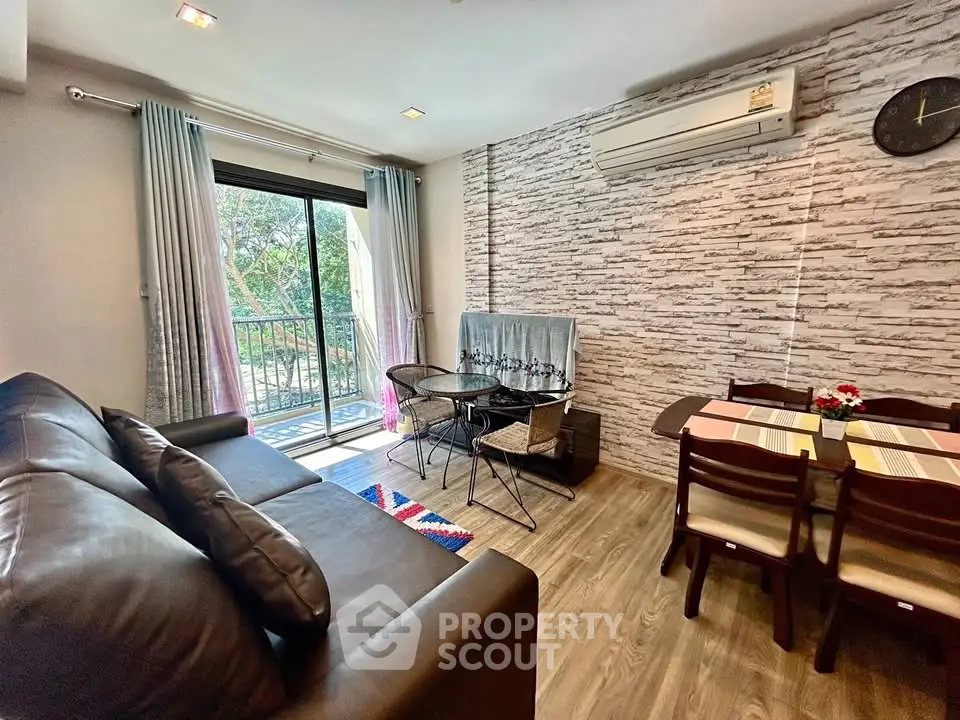 Modern living room with balcony access and stylish decor