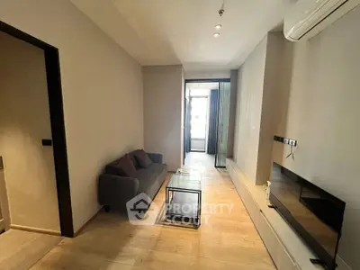 Modern living room with sleek design and cozy sofa in a stylish apartment.