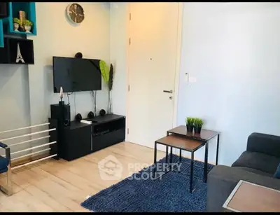 Modern living room with sleek furniture and wall-mounted TV