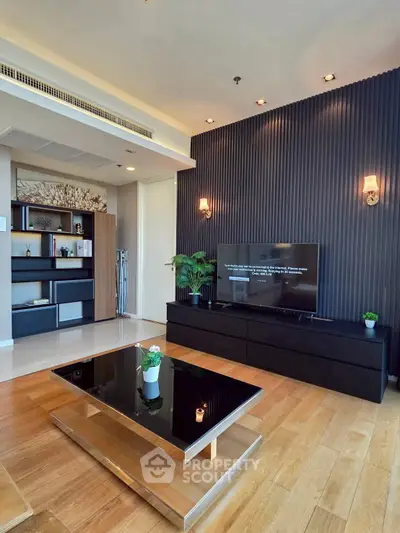 Modern living room with sleek design, wooden flooring, and stylish decor