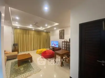 Spacious living room with modern decor and cozy seating area