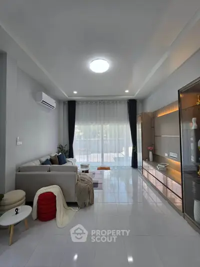 Spacious modern living room with elegant decor and large windows