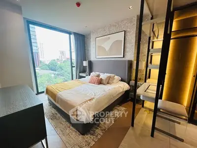Luxurious modern bedroom with large window and stylish decor in urban apartment.