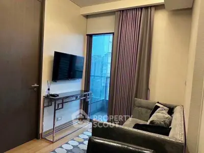 Modern living room with sleek furniture and large window view.