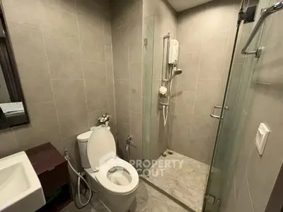 Modern bathroom with glass shower and sleek fixtures