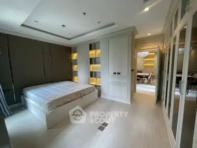 Luxurious modern bedroom with elegant built-in storage and ambient lighting