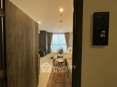 Modern living room with elegant decor and natural light, perfect for urban living.