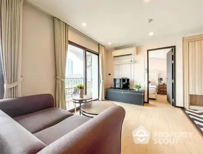 Spacious living room with modern decor and balcony access in luxury apartment