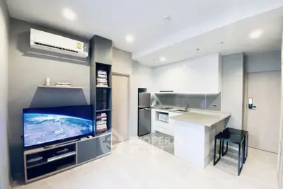 Modern open-layout living room with sleek kitchen and stylish decor