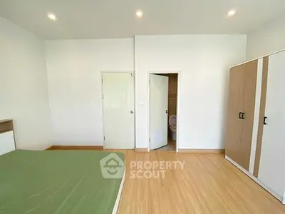 Spacious bedroom with ensuite bathroom and modern wardrobe