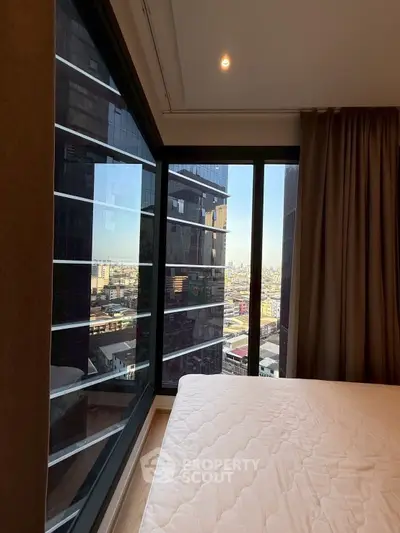 Modern bedroom with stunning city view through large corner windows