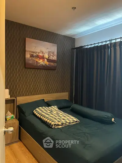 Cozy bedroom with modern decor and dark curtains, perfect for restful nights.